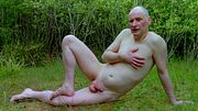 Jonathan outside naked reclining cock erect says he is an exhibitionist then thrusts his hard dick into the ground