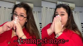 Blowing his nose like a trumpet + close-up