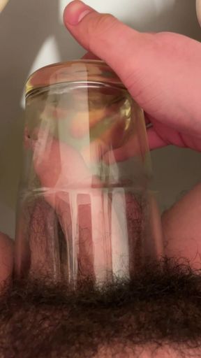 my uncut dick pissing in a glass cup