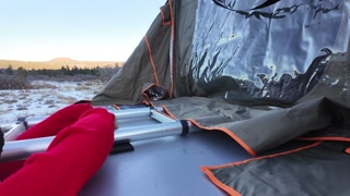 Mountain girl shows off rooftop tent set up and light up butt plug