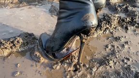 53_Alena walks through the mud in high heels ankle boots