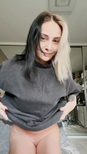 Slim blonde goth alt girl poses with barely legal natural tits