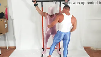 Muscle daddy in latex and spandex dominates his glazed sub