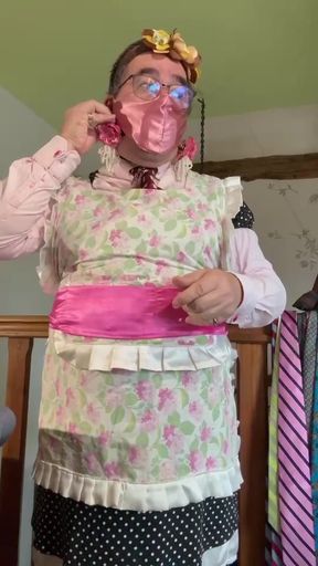 Dressed as a maid to put on a gag and a mask for some sewing