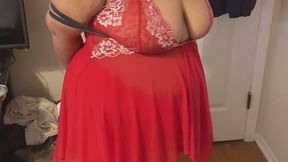 Krystal in an early video, showing off her tape gag and red lingerie