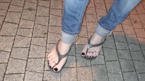 a foot fetishist walks the street in sexy flip-flops and gets horny