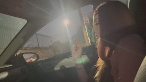 Artemisia Love smoking a cigarette in the car at night