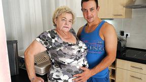 ”Buxom gilf sucking & fucking a way younger dude in her kitchen”