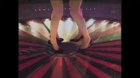 A Blonde and a Brunette Put on a Show in an Exclusive Club