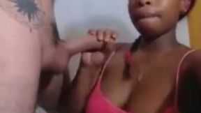 Sucking a white lollipop