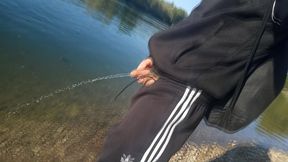 Who will spot this twink in a black and white adidas tracksuit, flashing his cock in public going commando freeballing, peeing i