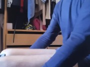 Jerking off sitting on a chair in a dressing room