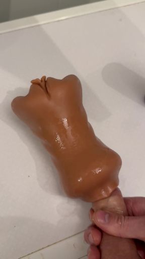 The guy jerks off and cums on his pocket vagina.