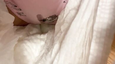 By the Christmas tree pissing in cute panties under a diaper