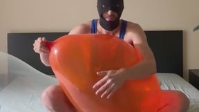 Inflating a qualatex q24 while sitting on a clear Roomtex 24” in my blue wrestling singlet [non-pop]
