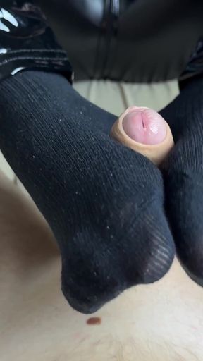 Female domination of cock with feet from mistress in latex suit   Clip 1