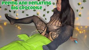 Deflating my big inflatable crocodile and peeing on it