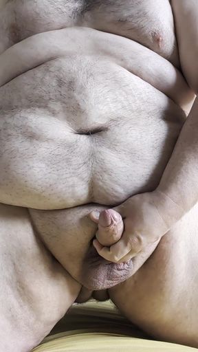 Mature man masturbating in studio
