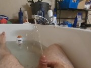 Guy gives himself a golden shower in the bathtub.  Hot urine for hot daddy