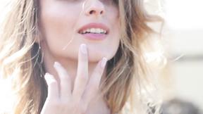 ”Pretty lady teasing at the beach nude”