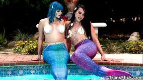 Jewelz Blu makes the perfect mermaid to be fucked by another tranny mermaid named Kasey Kei. Watch them as they reveal what'_s hidden behind their legs