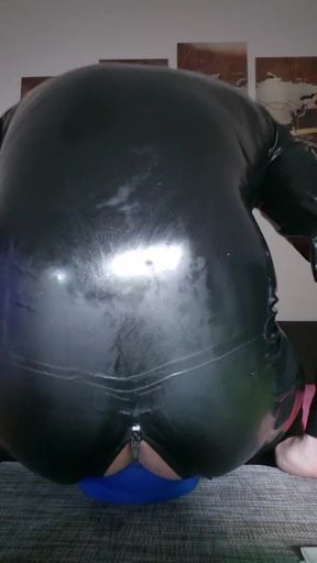 Rubber slave tries to fill his hole with the butt plug Grip144