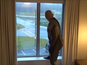 silicone masked wetsuited guy gets horny at hotel window and humps his pillows