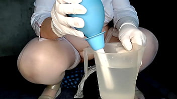 Enema for the nurse&#039_s vagina over the patient&#039_s face