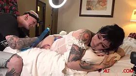 Busty brunette Misha Montana gets a new leg tattoo