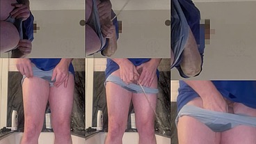 Desperate amateur guy enters the bathtub and pees his light blue briefs