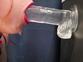 Oral sex on a sextoy with red lipstick