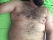 Big horny Italian hairy bearded bear wanking his cock on the bed in his underwear. Full body