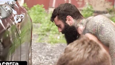 Horny guy is riding bearded stranger's cock inside the van