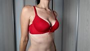 MILF tries on different bras and shows her saggy tits and stretch marks