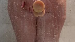 Riding Big Dildo against Glass Wall in the Shower with Big Fat BBW Ass