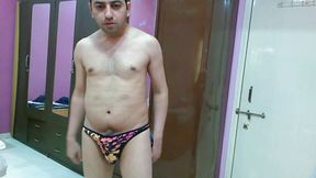 Hot nude boy trying out his new animal printed sexy thong.