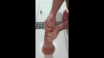 In the bathroom sticking dildos in my ass