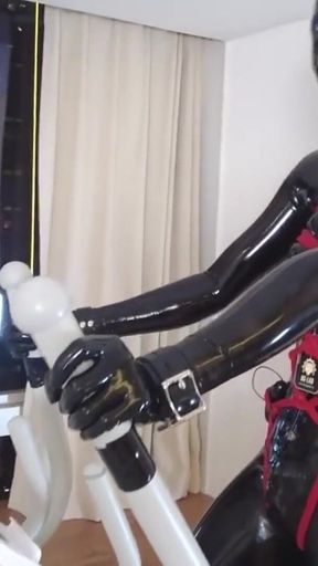 Mz27 - a Girl Bound in Latex Walks on a Treadmill