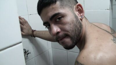 Gay dude sucks his mate's cock inside a gym shower