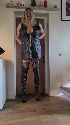 sissy in leather dress and thigh boots