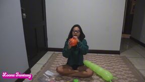 Akina plays and pops shaped balloons