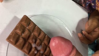 Stepdaughter eating chocolate with cum