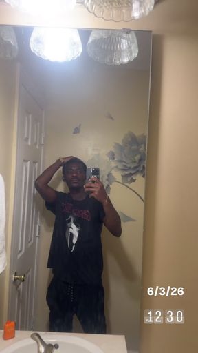Man in bathroom mirror