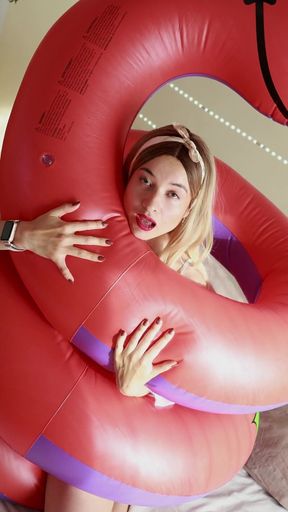 A Sexy Girl Rides an Inflatable Snake in Provocative Lingerie