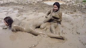 two thai girls in mud