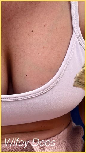 Wifey shows perfect cleavage in this tight white sports bra check out this hot MILF amazing cleavage