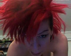 Redhead punk babe teases with her perky rack and booty on webcam