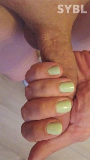 Crossdresser masturbating with green skirt and heels