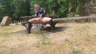 MILF pissing and rubbing shaved pussy beside public highway