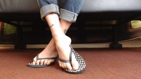 Dotted flipflop shoe play closeup